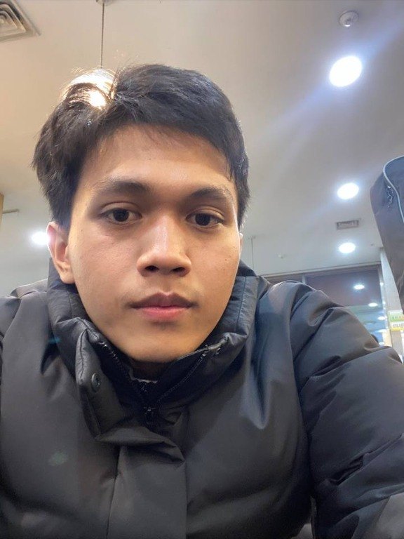 Aksara in a black jacket